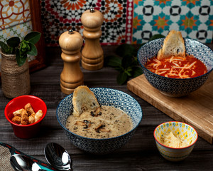 mushroom and tomato soups on the table