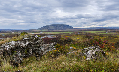 Fototapeta na wymiar typical icelandic landscape near Kerid Crater Lake, formed from an inactive volcano, can be found off the Golden Circle Iceland