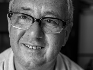 Portrait of an elderly man with glasses