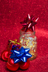 Christmas ornaments on red background with lights like stars