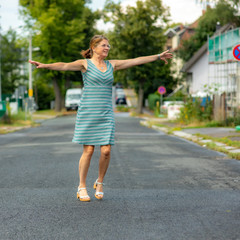 Woman with rotating poses on the road