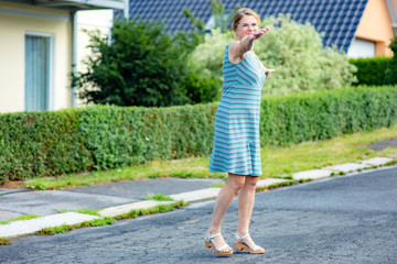 Woman with rotating poses on the road
