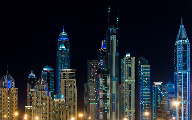 Fototapeta na wymiar city of lights dubai marina captured at night with magnificent and high buildings 