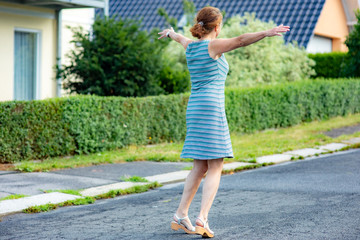 Woman with rotating poses on the road