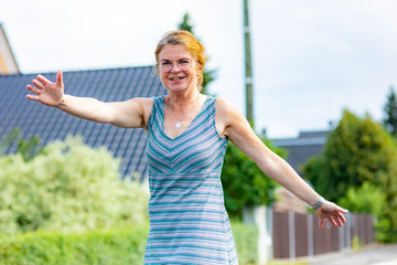 Woman turns for joy outdoors