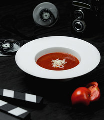 tomato soup with sliced tomato