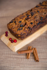 Homemade fruit bread with cosy winter decorations