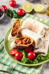 Burritos wraps with mincemeat, beans and vegetables