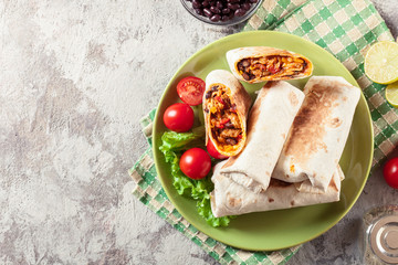 Burritos wraps with mincemeat, beans and vegetables