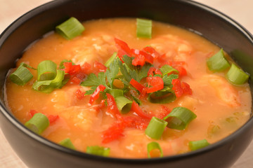 shrimp moqueca with chives, parsley and pepper