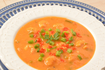 shrimp moqueca with chives, parsley and pepper