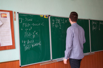 close up of math formulas on a blackboard