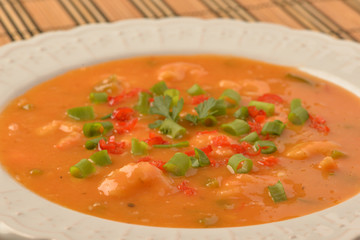 shrimp moqueca with chives, parsley and pepper