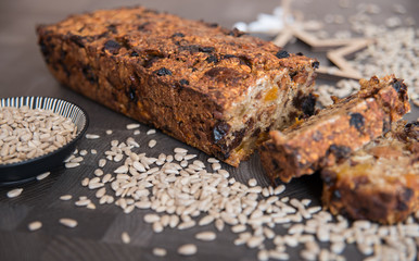 Homemade fruit bread with cosy winter decorations