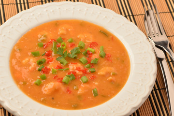 shrimp moqueca with chives, parsley and pepper