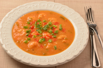 shrimp moqueca with chives, parsley and pepper