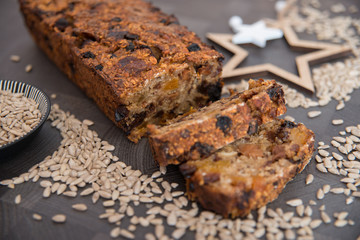 Homemade fruit bread with cosy winter decorations