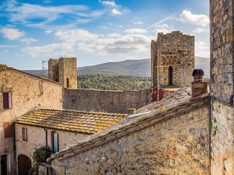 Siena, Italy: Panorama Of Medieval Village Of Monteriggioni Within The Defensive Walls In Tuscany Architecturally Significant, Referenced In Dante Alighieri Divine Comedy