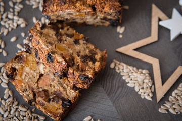 Homemade fruit bread with cosy winter decorations