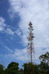 Wireless Communication Antenna With bright sky.Telecommunication tower with antennas.High pole for signal transmission. There are both wireless phone systems and microwave systems.