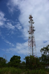 Wireless Communication Antenna With bright sky.Telecommunication tower with antennas.High pole for signal transmission. There are both wireless phone systems and microwave systems.