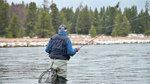 fly fisherman on Henry's Fork in Idaho