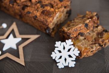 Homemade fruit bread with cosy winter decorations