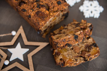 Homemade fruit bread with cosy winter decorations