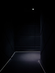 Corner of a dimmed empty corridor of a building