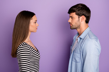 Profile photo of two people couple guy lady standing opposite looking eyes have conflict situation wear stylish casual outfit isolated pastel purple color background