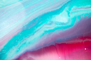 Abstract fluid acrylic painting. Marbled blue abstract background. Liquid marble pattern. Hand painted background with mixed liquid red, blue and green paints. Modern art. 