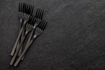black forksd on gray ceramic background