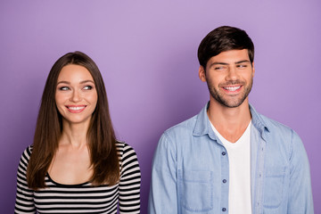Photo of two people couple looking eyes each other have creative tricky plan know private secret wear stylish casual outfit isolated pastel purple color background