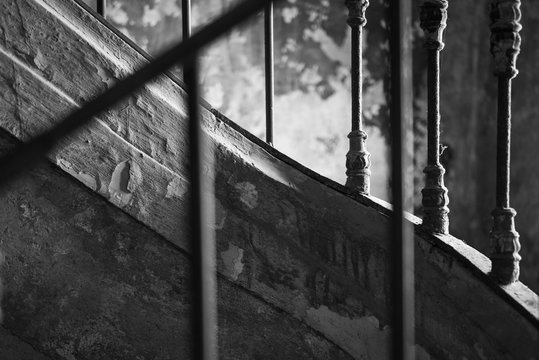Black and white arty picture of old stairs and guardrail