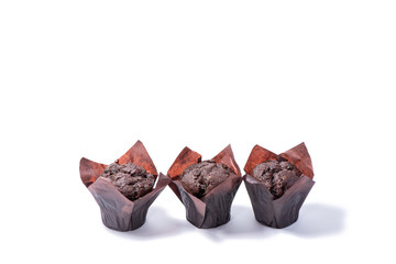 Delicious chocolate muffins isolated on white background.