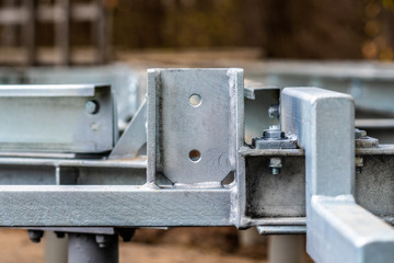 Metal structure  bolted together and painted with silver paint