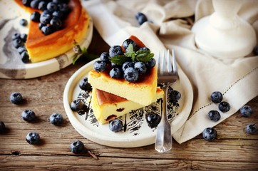 Cottage cheese casserole with blueberries on a wooden background