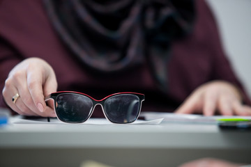 businessman using hand sign while talking to his colleague in office.