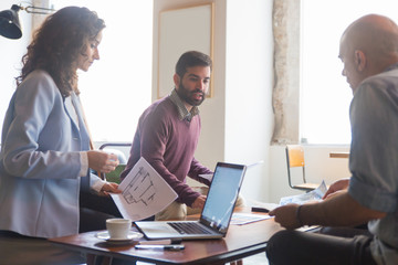 Obraz premium Architect and interior designer working on renovation project with client. Group of people meeting at home or in designer office. Home design professionals concept