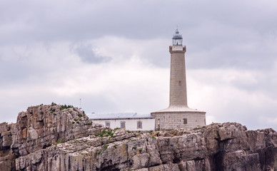 Fototapeta na wymiar Lighthouse in a rocky island