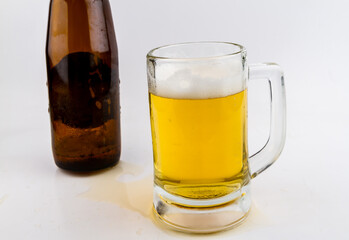 Ready beer to drink in a glass on a white background. Mug beer