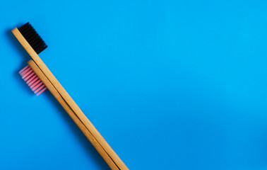 eco natural bamboo toothbrushes on blue background. zero waste flat lay 11