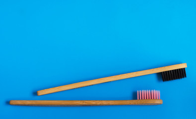 eco natural bamboo toothbrushes on blue background. zero waste flat lay 12