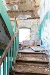 old dirty ruined staircase in an abandoned house