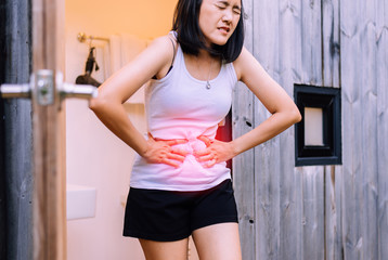 Woman having painful stomachache at home,Period cramps