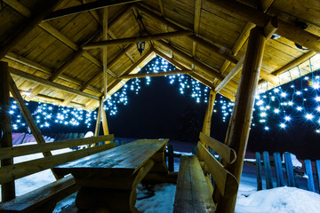 Wooden arbor with Christmas lights