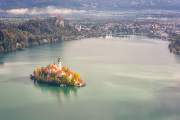 Famous alpine Bled lake (Blejsko jezero) in Slovenia, amazing autumn landscape. Aerial view of the...