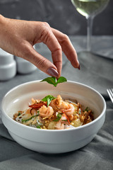 Rice noodles with shrimps and seafood, spicy asian style noodles in bowl.