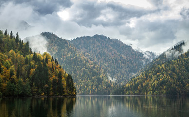 Fototapeta na wymiar Beautiful mountain lake in the clouds