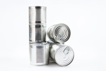 Group of silver canned food on white background.